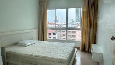 Bright bedroom with large window