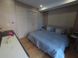 Cozy bedroom with double bed and modern furniture