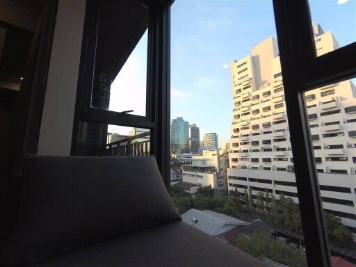 View from a high-rise apartment window showing cityscape