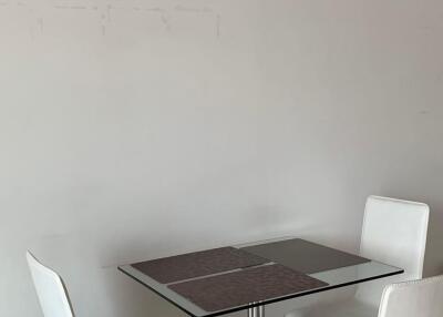 Small dining area with a table and chairs