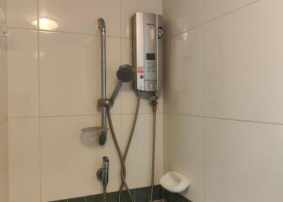 Bathroom with shower and water heater