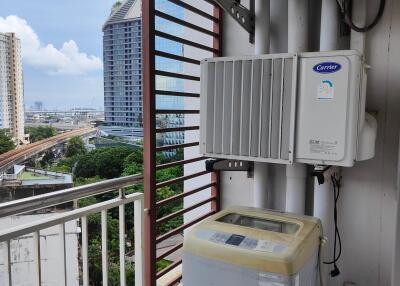 Balcony with air conditioning units and washing machine