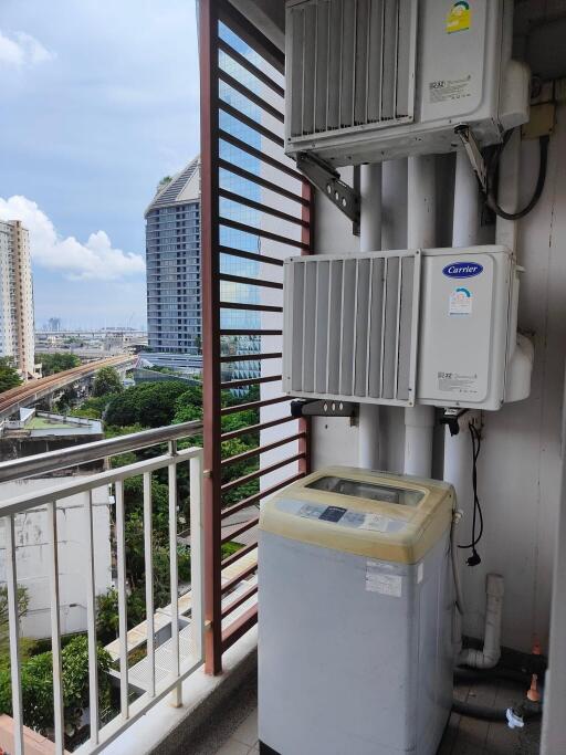 Balcony with air conditioning units and washing machine