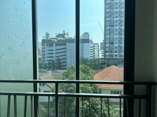 View from the balcony overlooking the city buildings and greenery