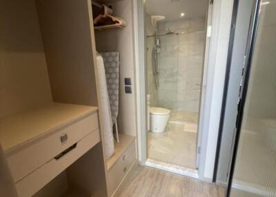 Walk-in closet leading to en-suite bathroom