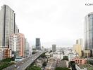 City skyline with tall buildings and highway