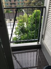 Balcony with railing overlooking trees