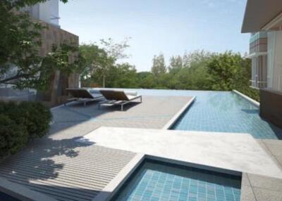 Outdoor pool area with lounge chairs and trees