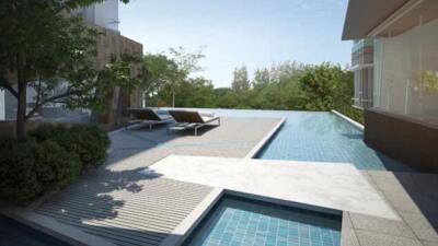 Outdoor pool area with lounge chairs and trees