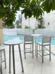 Outdoor seating area by the pool