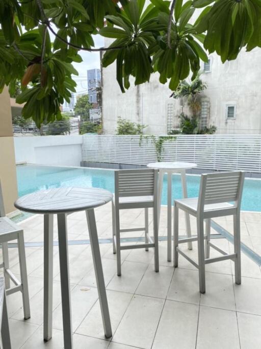 Outdoor seating area by the pool