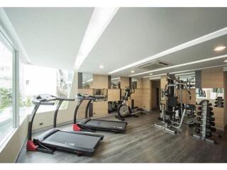 Modern home gym with various exercise equipment