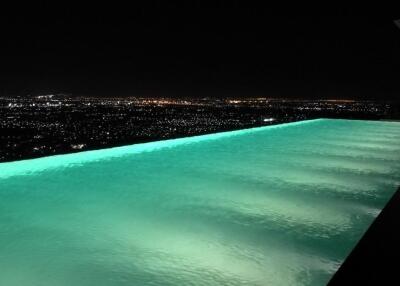Infinity pool with night city view