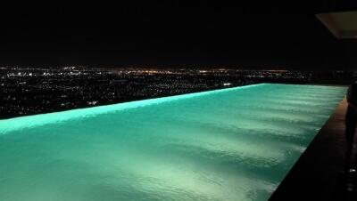 Infinity pool with night city view