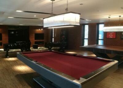 Modern game room with pool table and table tennis