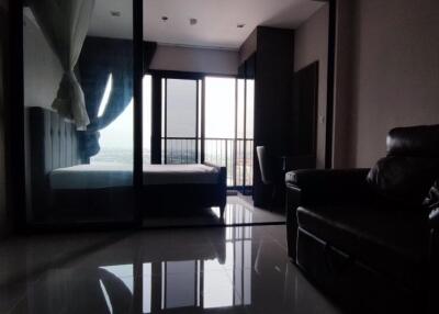 Modern bedroom with glass partition and balcony view