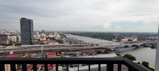 View from balcony overlooking a city and river