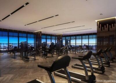 Spacious fitness center with multiple exercise machines and panoramic city views