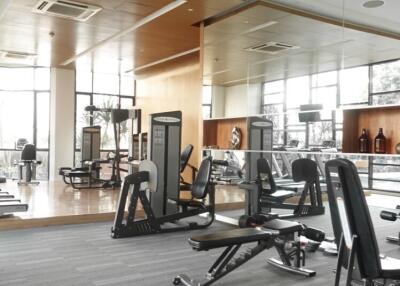 Modern fitness center with various gym equipment