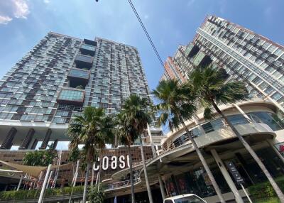 High-rise residential buildings with modern architecture and palm trees