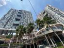 High-rise residential buildings with modern architecture and palm trees