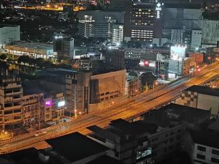 Nighttime view of city buildings and roads