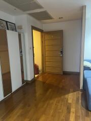 Bedroom with wooden floor and wardrobe