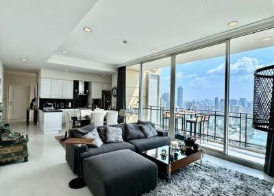 Modern living room with city view and open kitchen
