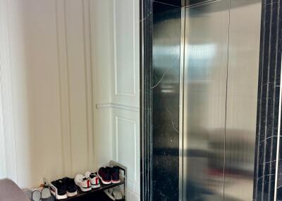 Elevator area with shoe rack