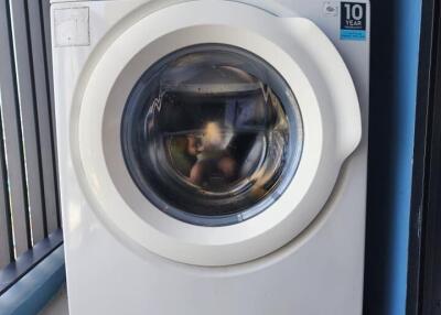 Washing machine in laundry area