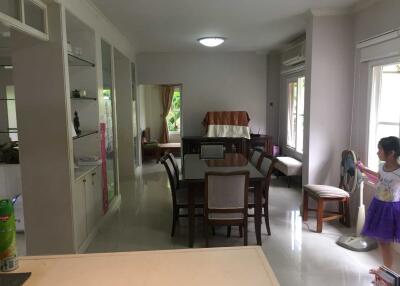 Dining area with table, chairs, and cabinets