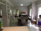 Dining area with table, chairs, and cabinets