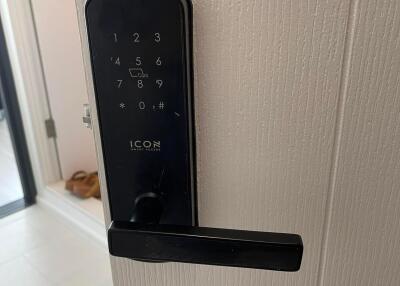 Digital door lock keypad on a wooden door