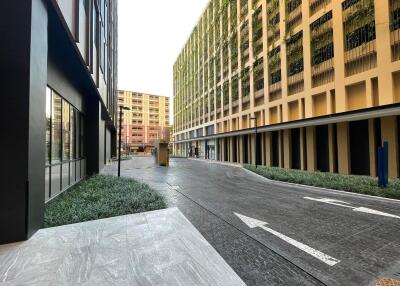 Modern commercial buildings with paved walkway