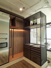 Modern bedroom closet with built-in shelving and storage