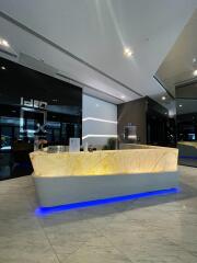 Modern lobby with illuminated reception desk