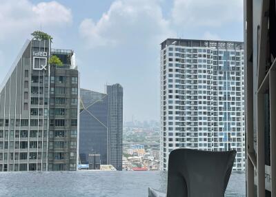 Skyline view from an infinity pool with modern high-rise buildings