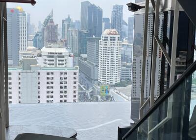 View of cityscape from high-rise building with modern interior