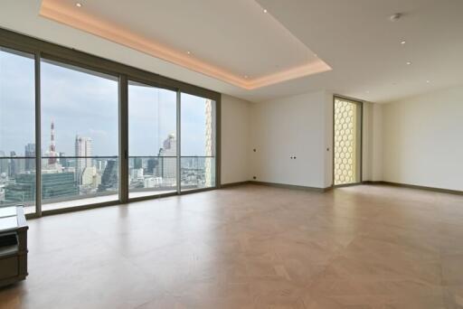 Spacious living room with large windows and city view