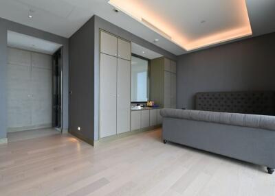 Modern bedroom with sleek storage cabinets and a large bed
