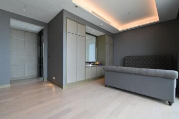 Modern bedroom with sleek storage cabinets and a large bed