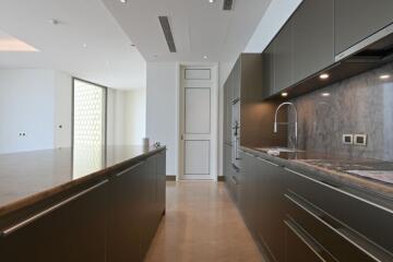 Modern kitchen with marble countertop and stainless steel appliances