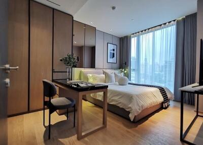 Modern bedroom with large windows and stylish furniture