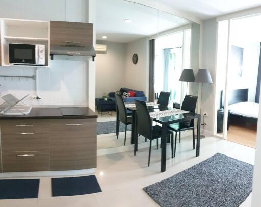 Modern kitchen and dining area with adjacent living space