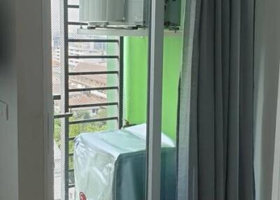 Enclosed balcony area with air conditioning unit