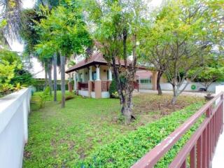 Exterior view of a residential house with front yard