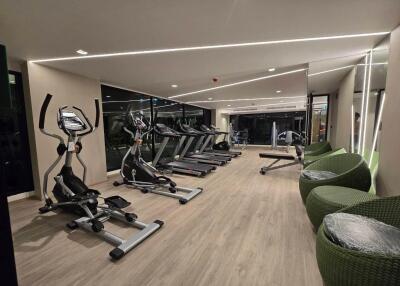 Modern gym with assorted cardio machines and equipment