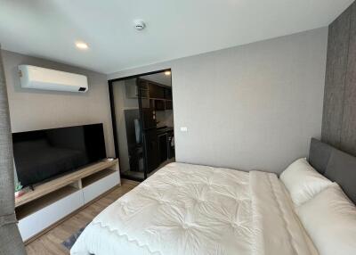 Cozy bedroom with modern furniture and split AC unit