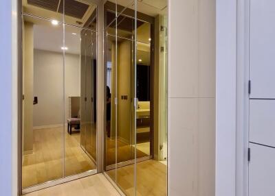 modern hallway with mirrored closet