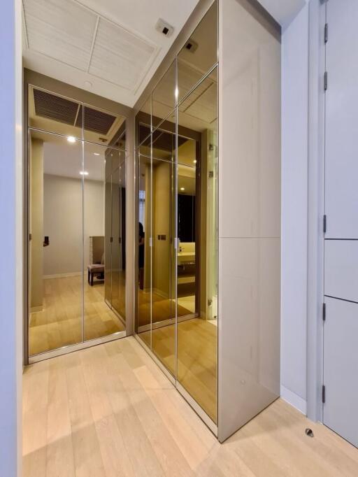 modern hallway with mirrored closet